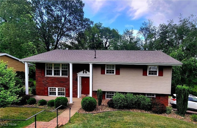 112 Laurel Ln, Washington, WV 26181 - raised ranch with a front lawn and brick siding