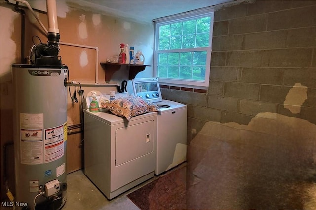 112 Laurel Ln, Washington, WV 26181 - laundry area with washing machine and dryer, gas water heater, and concrete block wall