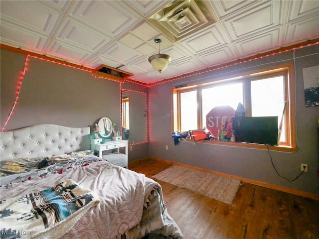 32701 Gundy Ridge Rd, Bowerston, OH 44695 - bedroom featuring wood finished floors and an ornate ceiling