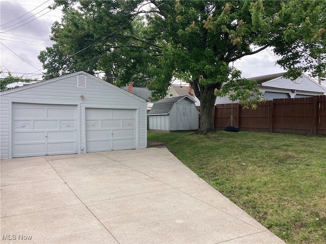 7611 Liberty Ave, Parma, OH 44129 - view of yard featuring a garage and a storage shed