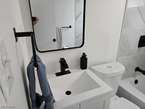 7611 Liberty Ave, Parma, OH 44129 - full bathroom featuring vanity and shower / washtub combination