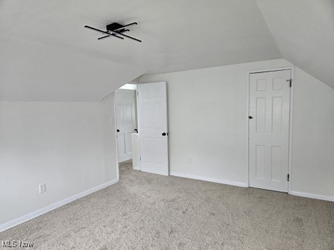 7611 Liberty Ave, Parma, OH 44129 - additional living space with lofted ceiling and carpet
