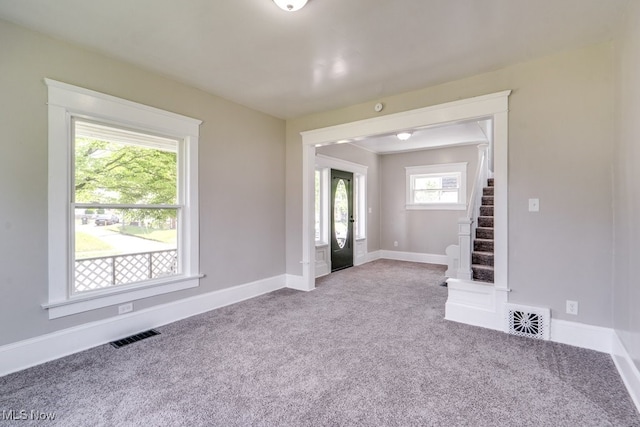 1017 Smith Ave SW, Canton, OH 44706 - unfurnished room featuring carpet floors and stairs