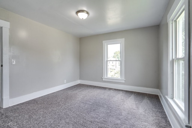 1017 Smith Ave SW, Canton, OH 44706 - carpeted empty room featuring baseboards