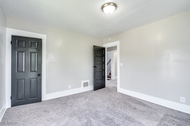 1017 Smith Ave SW, Canton, OH 44706 - carpeted empty room with baseboards