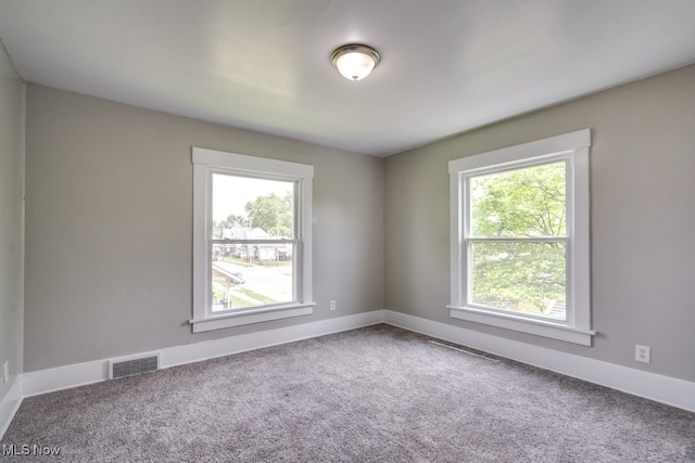 1017 Smith Ave SW, Canton, OH 44706 - carpeted spare room featuring baseboards