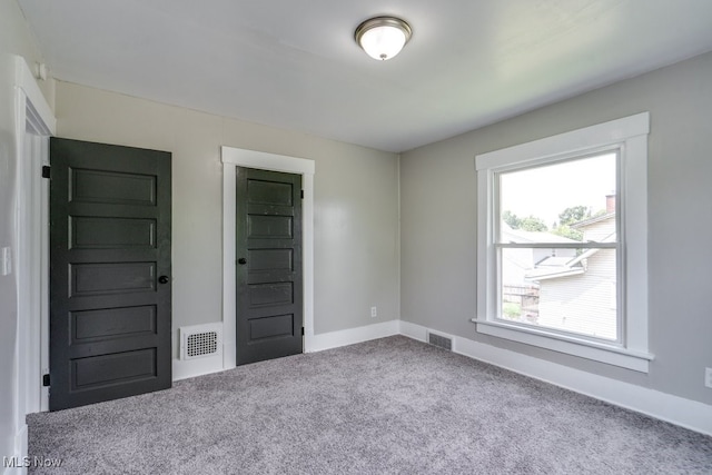 1017 Smith Ave SW, Canton, OH 44706 - unfurnished bedroom featuring carpet floors and baseboards