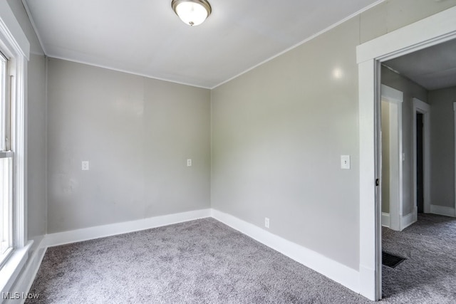 1017 Smith Ave SW, Canton, OH 44706 - carpeted spare room featuring crown molding