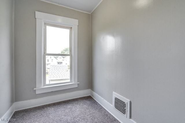 1017 Smith Ave SW, Canton, OH 44706 - carpeted spare room featuring healthy amount of natural light and crown molding
