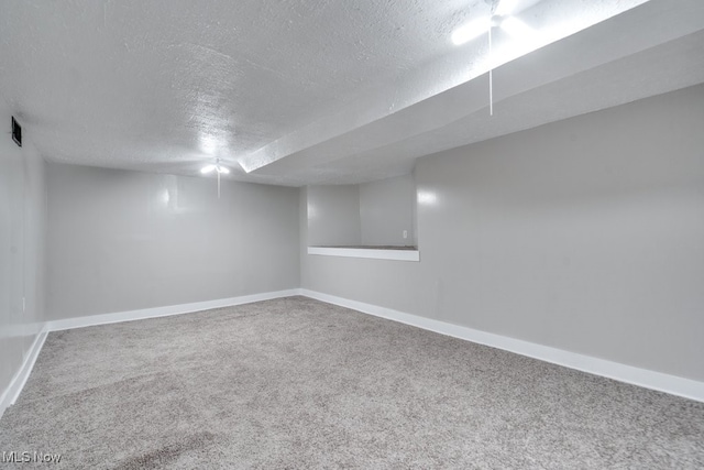 1017 Smith Ave SW, Canton, OH 44706 - finished below grade area with a textured ceiling and carpet flooring