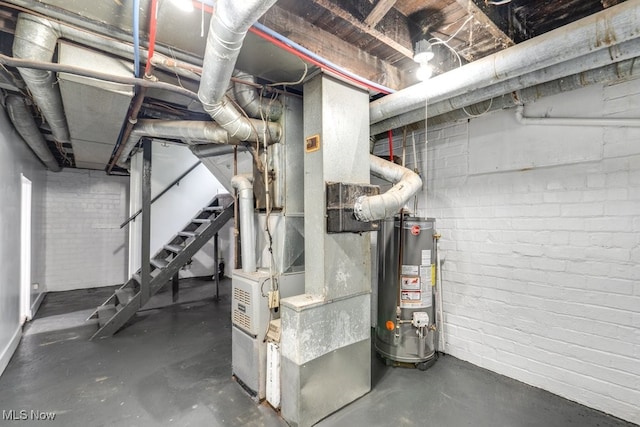 1017 Smith Ave SW, Canton, OH 44706 - unfinished basement with gas water heater and stairs