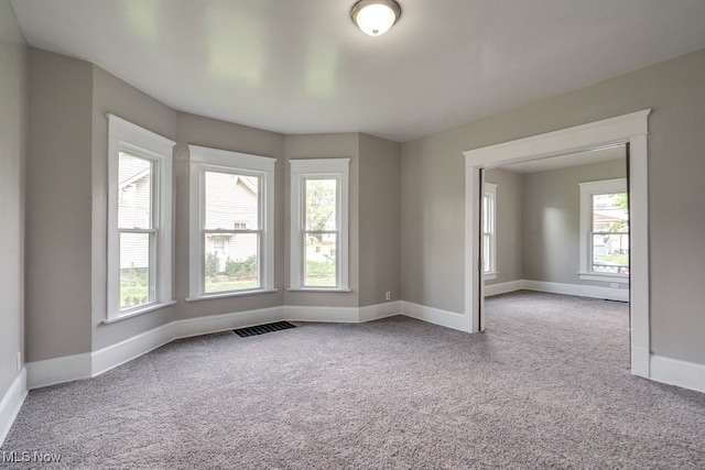 1017 Smith Ave SW, Canton, OH 44706 - carpeted spare room featuring plenty of natural light