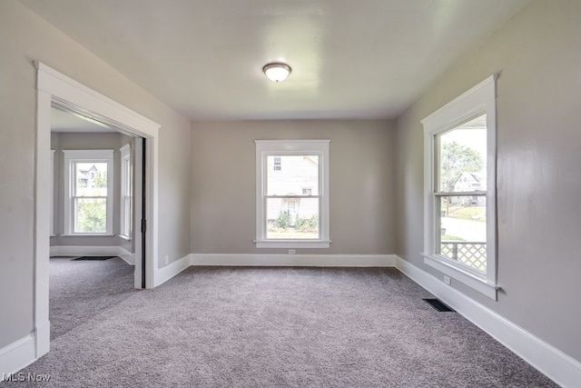 1017 Smith Ave SW, Canton, OH 44706 - unfurnished room featuring healthy amount of natural light and carpet flooring