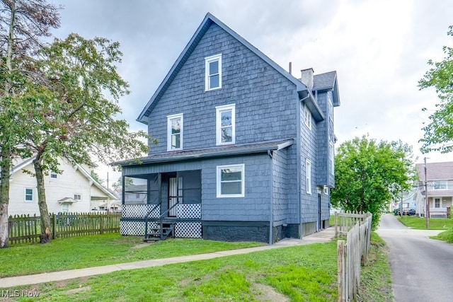 1017 Smith Ave SW, Canton, OH 44706 - view of front facade with a chimney and a porch