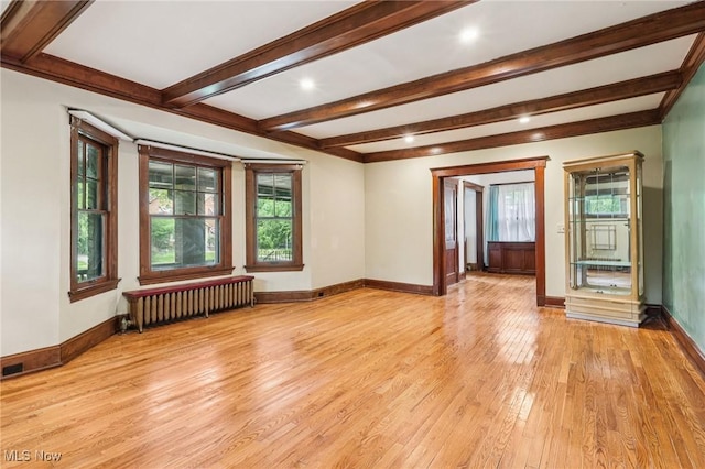 1575 E 108th St, Cleveland, OH 44106 - empty room with radiator heating unit, light wood-style flooring, beamed ceiling, and recessed lighting