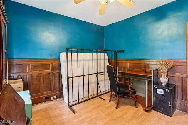 1575 E 108th St, Cleveland, OH 44106 - home office featuring wood finished floors, a ceiling fan, and a wainscoted wall