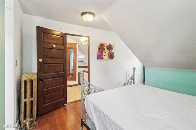 1575 E 108th St, Cleveland, OH 44106 - bedroom featuring dark wood-style floors and vaulted ceiling