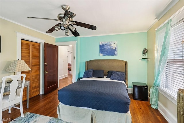 1575 E 108th St, Cleveland, OH 44106 - bedroom featuring wood finished floors, crown molding, a ceiling fan, and a closet