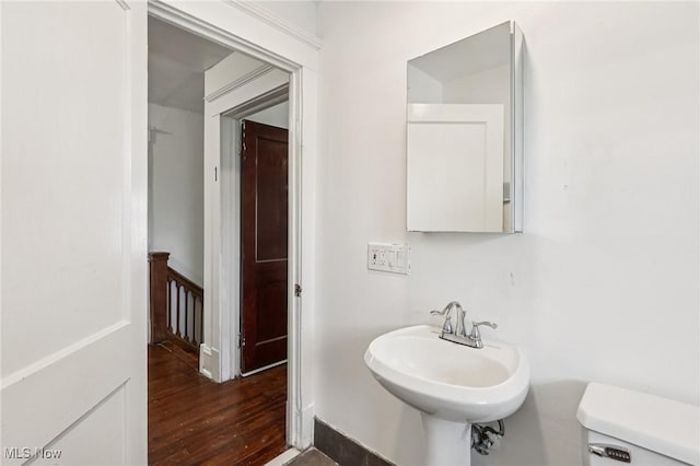 1575 E 108th St, Cleveland, OH 44106 - bathroom featuring toilet and wood finished floors