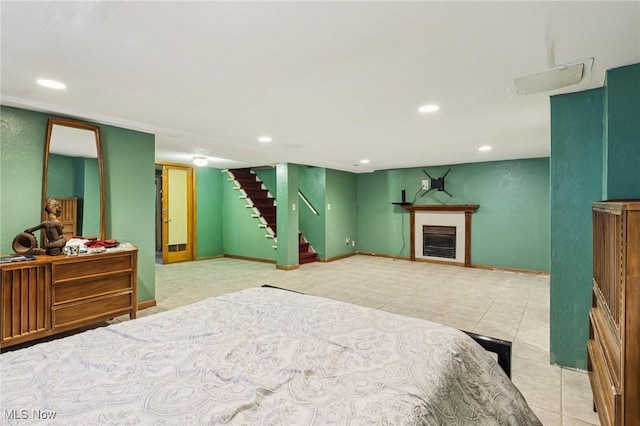 1575 E 108th St, Cleveland, OH 44106 - tiled bedroom featuring recessed lighting and a fireplace