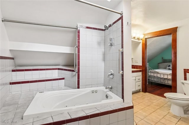 1575 E 108th St, Cleveland, OH 44106 - full bath with a combined bath / shower with jetted tub, tile patterned flooring, and ensuite bathroom