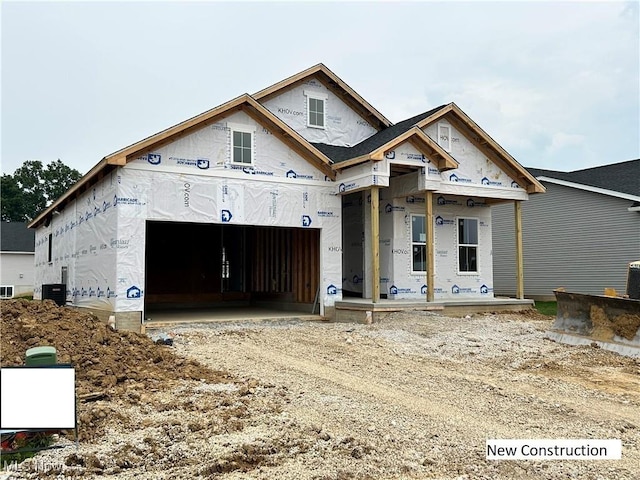 8932 Camden Rd NW, Massillon, OH 44646 - unfinished property with driveway, an attached garage, and covered porch