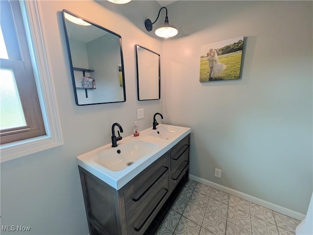 3439 Rough And Ready Rd, New Concord, OH 43762 - bathroom featuring double vanity and baseboards