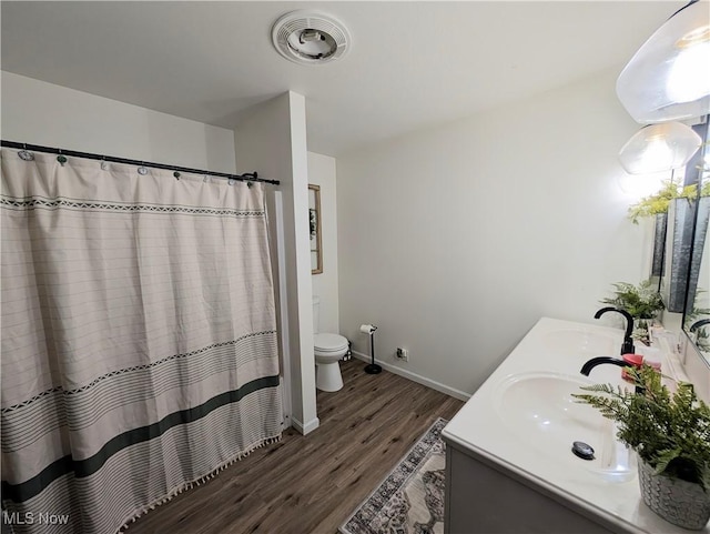 3439 Rough And Ready Rd, New Concord, OH 43762 - bathroom with wood finished floors, double vanity, and a shower with shower curtain