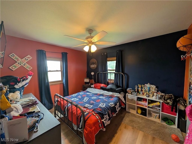 3439 Rough And Ready Rd, New Concord, OH 43762 - bedroom featuring wood finished floors, multiple windows, and ceiling fan