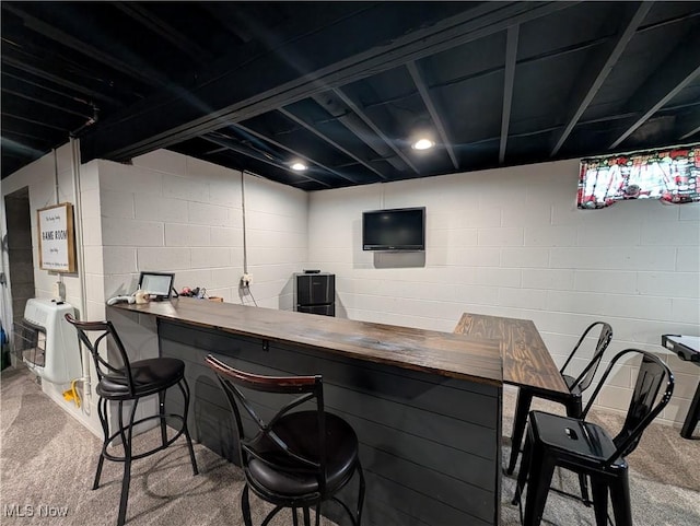 3439 Rough And Ready Rd, New Concord, OH 43762 - indoor dry bar with carpet, heating unit, and concrete block wall