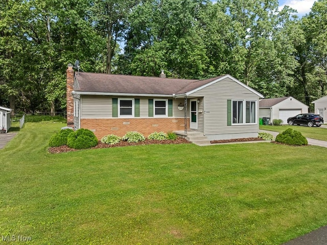 4000 Kenneth Rd, Stow, OH 44224 - ranch-style home with a chimney, brick siding, a front yard, and a garage