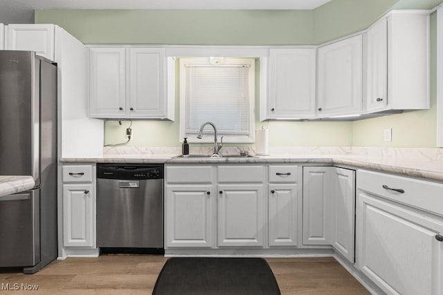 4000 Kenneth Rd, Stow, OH 44224 - kitchen featuring stainless steel appliances, white cabinetry, and light wood finished floors