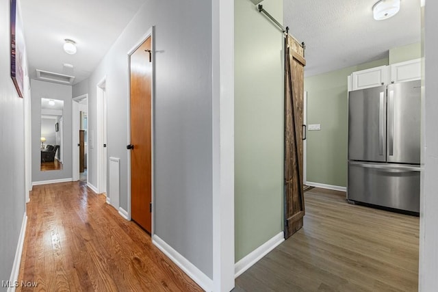 4000 Kenneth Rd, Stow, OH 44224 - hall featuring wood finished floors, a barn door, and attic access