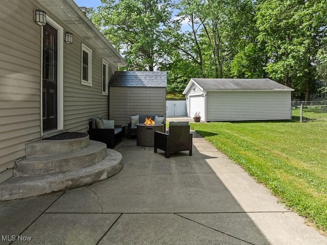 4000 Kenneth Rd, Stow, OH 44224 - view of patio / terrace featuring a fire pit, an outbuilding, and a garage