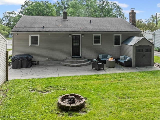 4000 Kenneth Rd, Stow, OH 44224 - back of property featuring a chimney, a yard, an outdoor living space with a fire pit, and a patio area