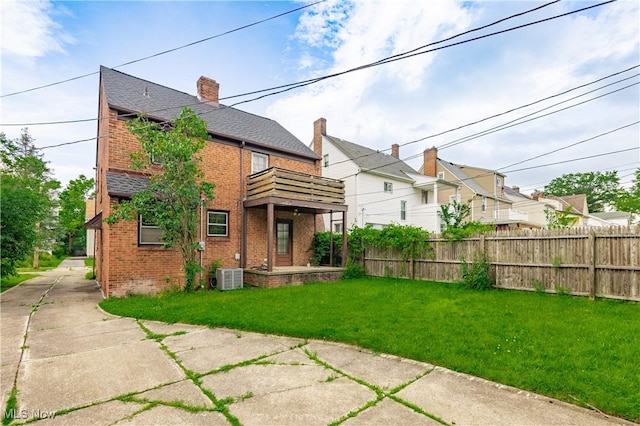 3526 Raymont Blvd, University Heights, OH 44118 - rear view of house featuring a balcony, brick siding, and a chimney
