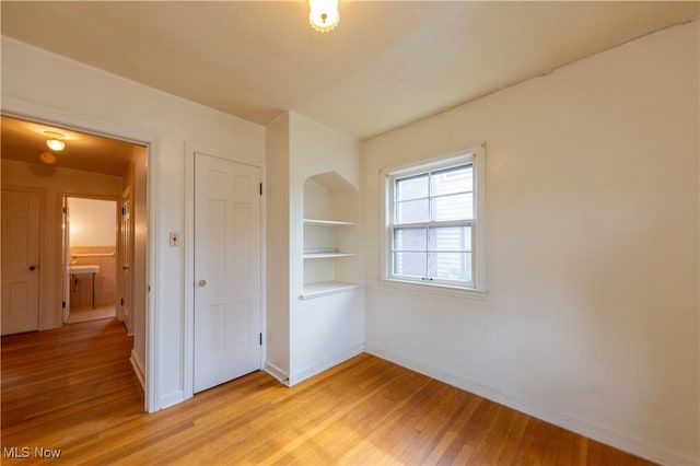 3526 Raymont Blvd, University Heights, OH 44118 - unfurnished bedroom featuring light wood-style flooring and baseboards