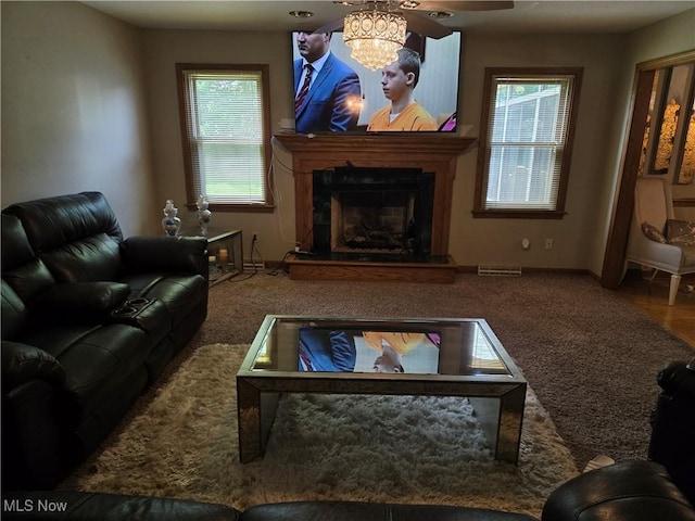 5256 S Saratoga Ave, Austintown, OH 44515 - living area with a fireplace with raised hearth, carpet floors, and ceiling fan