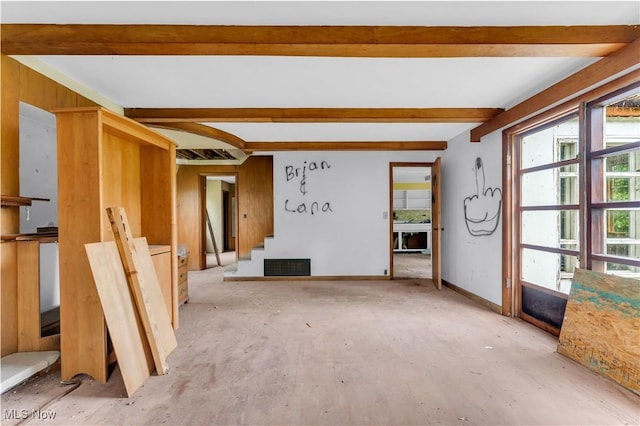 202 N State St, Rochester, OH 44090 - unfurnished living room with beamed ceiling and stairway