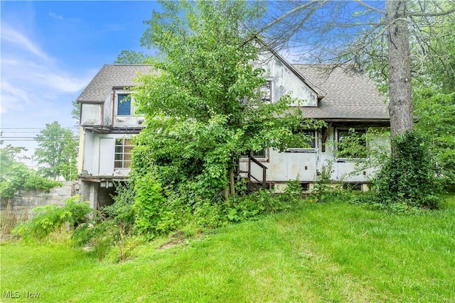202 N State St, Rochester, OH 44090 - rear view of property featuring a shingled roof