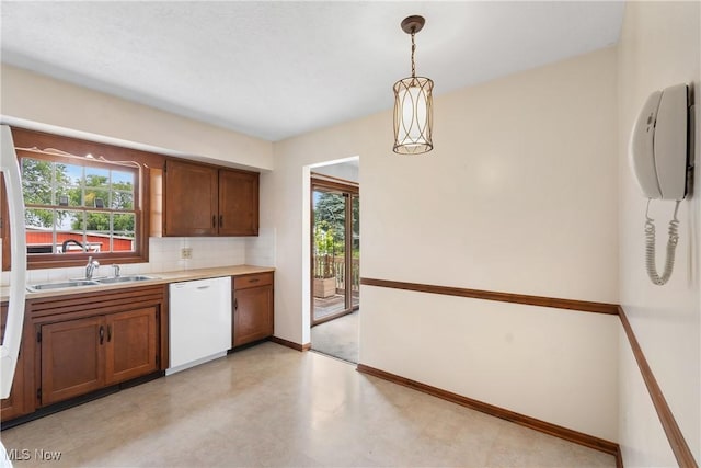 8471 Henry St, Navarre, OH 44662 - kitchen with dishwasher, plenty of natural light, tasteful backsplash, and light countertops