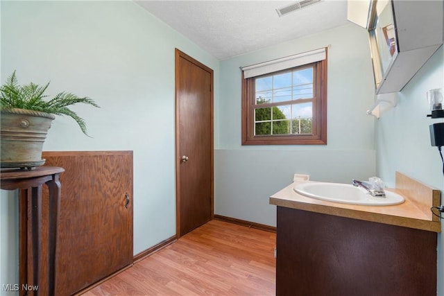 8471 Henry St, Navarre, OH 44662 - bathroom featuring wood finished floors and vanity