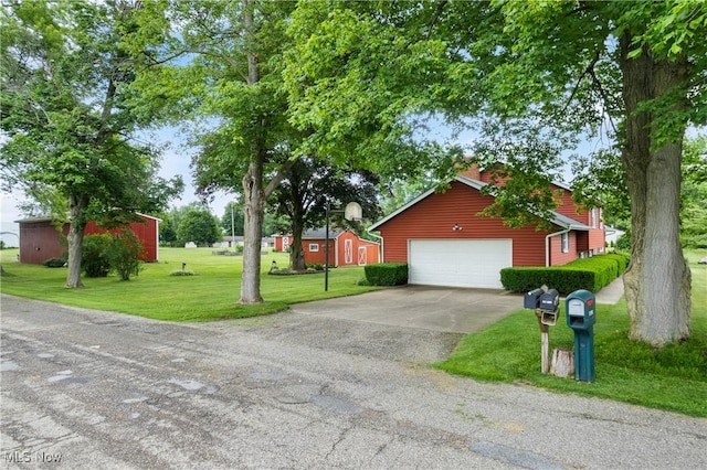 8471 Henry St, Navarre, OH 44662 - view of front of property featuring a front yard, driveway, an outbuilding, and a garage