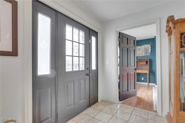 4495 Old River Rd, Philo, OH 43771 - foyer entrance featuring plenty of natural light and light tile patterned floors