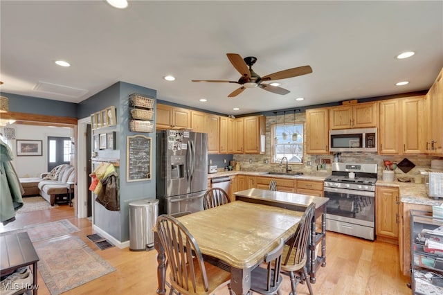4495 Old River Rd, Philo, OH 43771 - kitchen with stainless steel appliances, a ceiling fan, backsplash, light wood-style floors, and recessed lighting