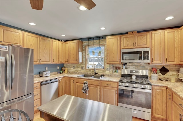 4495 Old River Rd, Philo, OH 43771 - kitchen with appliances with stainless steel finishes, light brown cabinetry, and recessed lighting