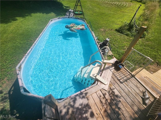 4495 Old River Rd, Philo, OH 43771 - view of swimming pool featuring a lawn and a wooden deck