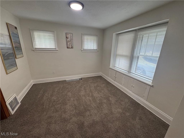 783 Jason Ave, Akron, OH 44314 - spare room featuring dark carpet