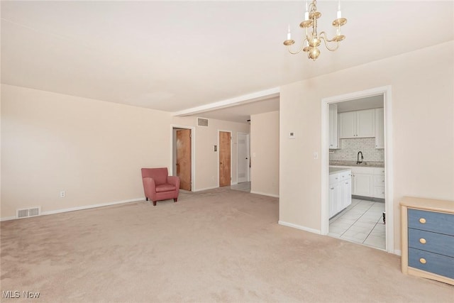 3271 Warrensville Center Rd Unit 4A, Shaker Heights, OH 44122 - unfurnished room with light carpet and a chandelier