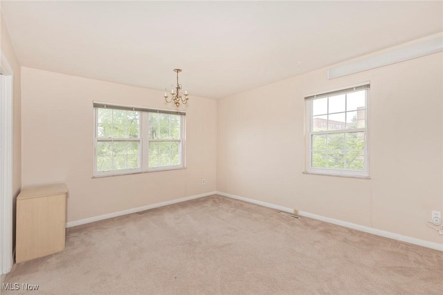 3271 Warrensville Center Rd Unit 4A, Shaker Heights, OH 44122 - empty room with a chandelier and light carpet